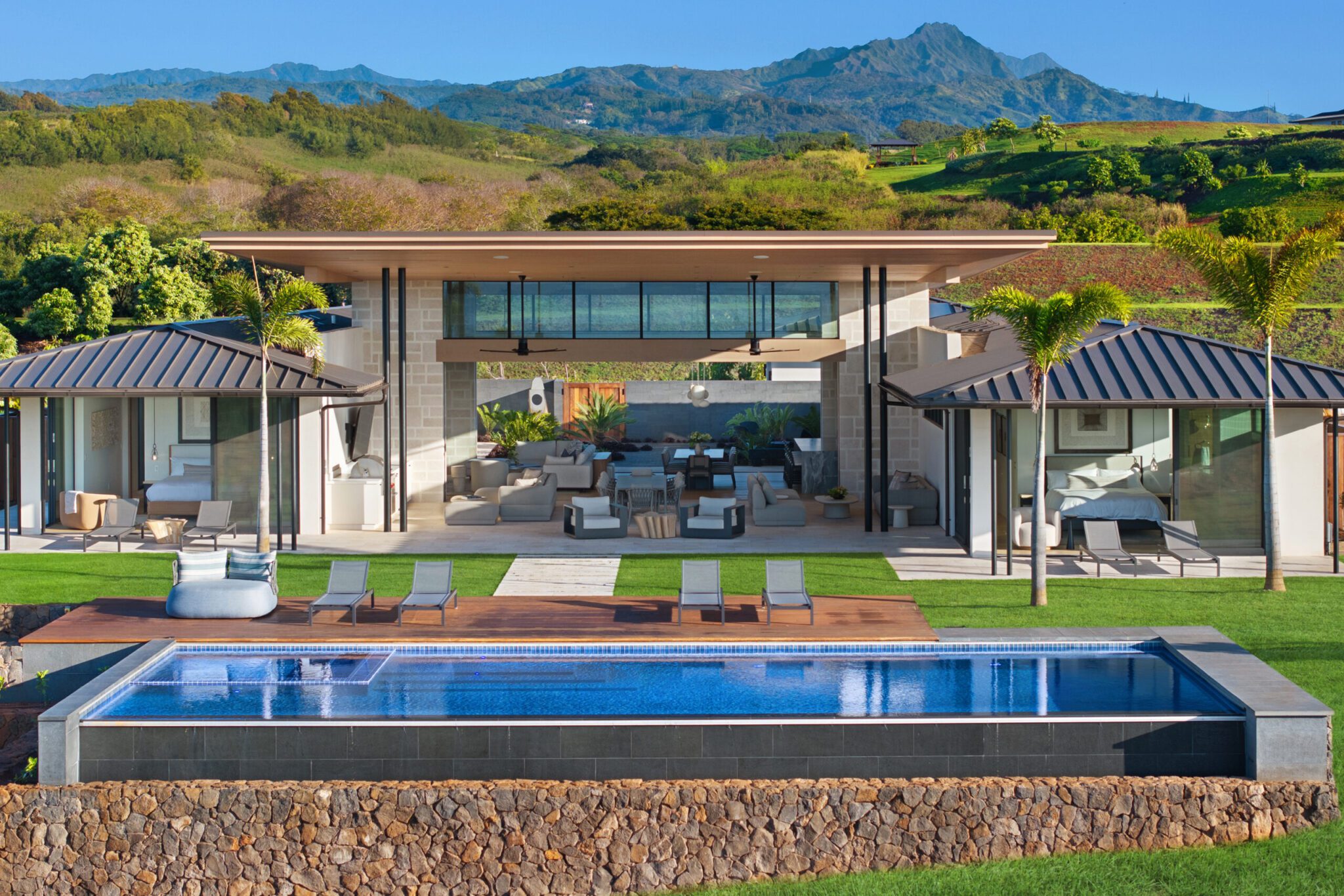 A large pool with chairs and tables in the middle of it.