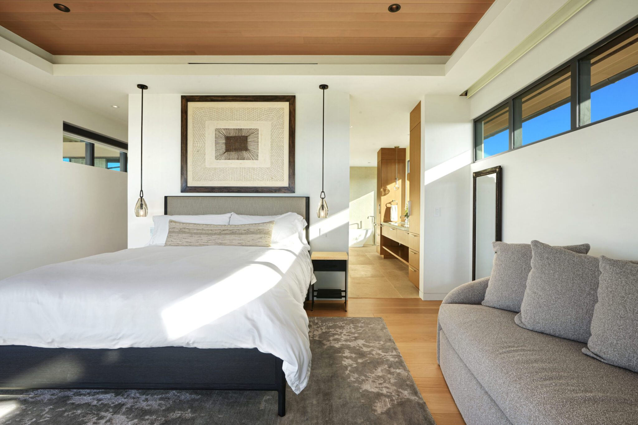 A bedroom with a couch and bed in it