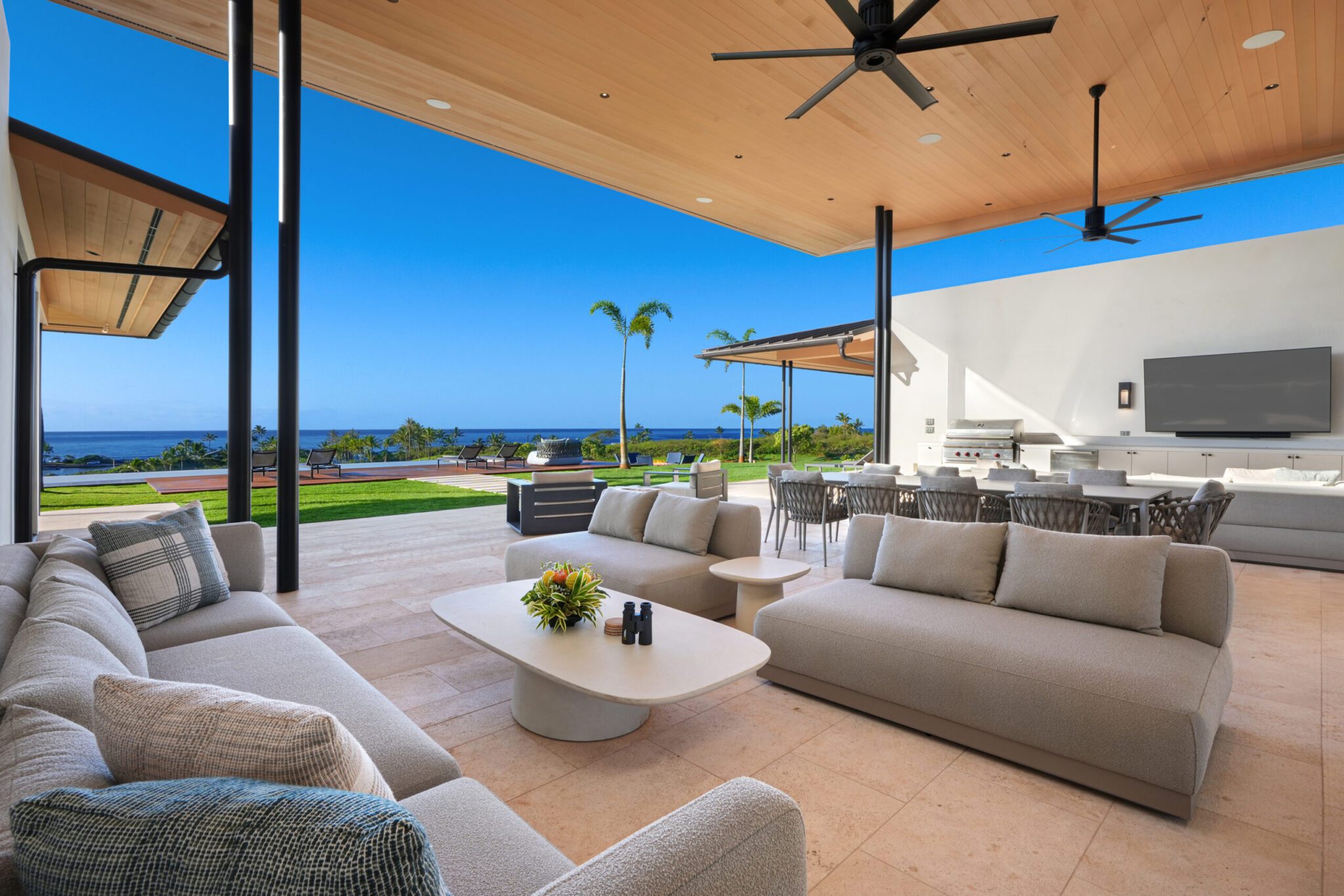 A large open living room with couches and tables.