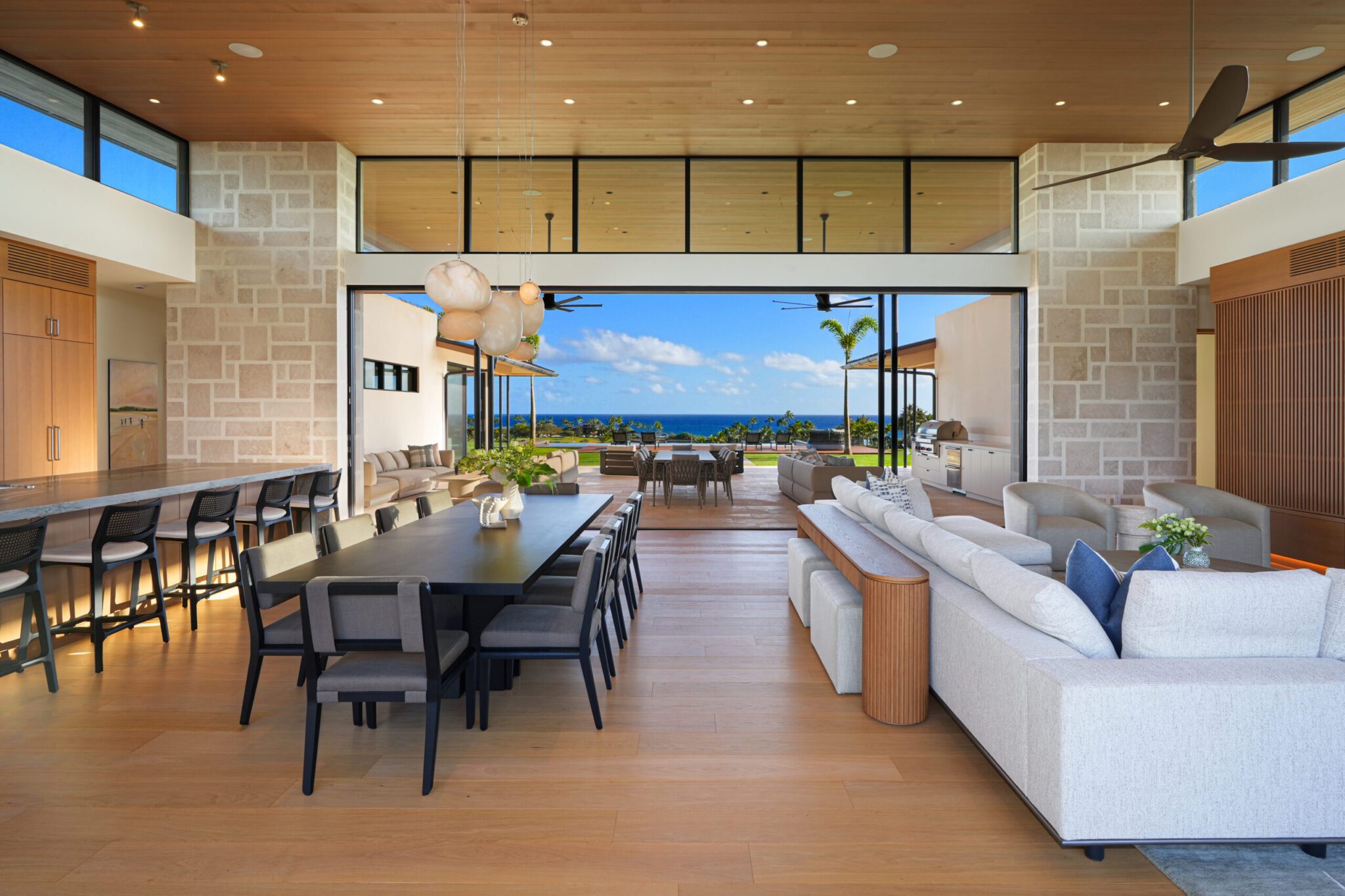 A large open living room with a dining table and chairs.