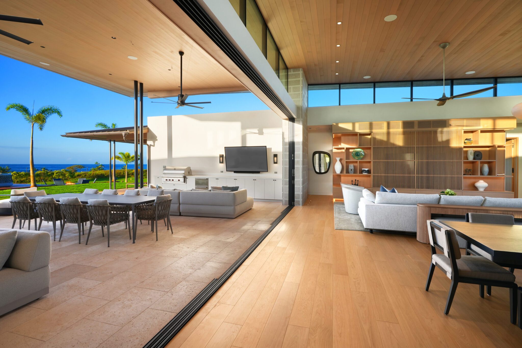 A living room with sliding glass doors and a large window.