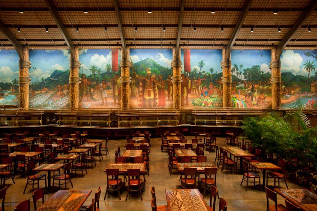 A large room with many tables and chairs.
