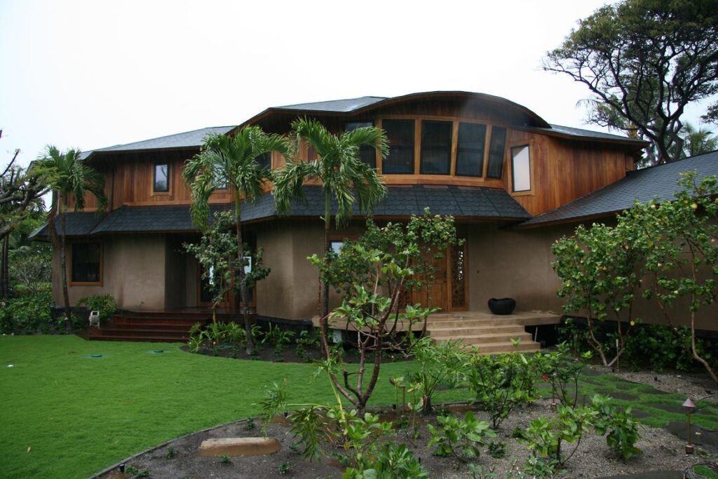 A large house with a garden in front of it