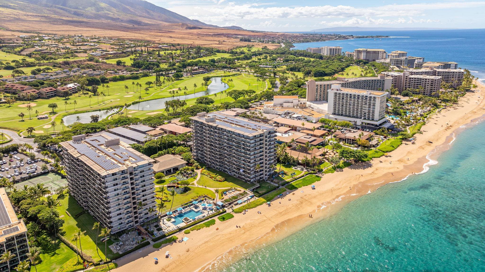 A view of the ocean and buildings from above.