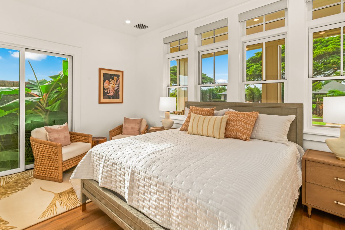 A large bed sitting in the middle of a bedroom.