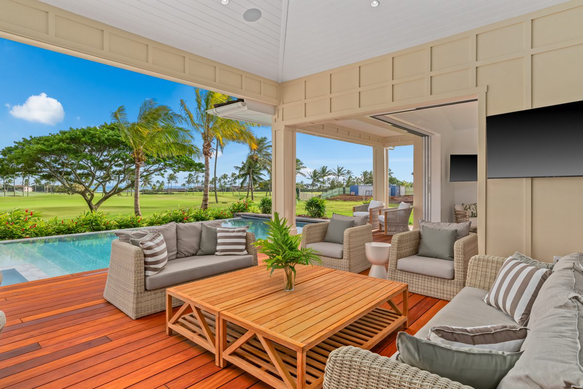 A large open living room with an outdoor patio.