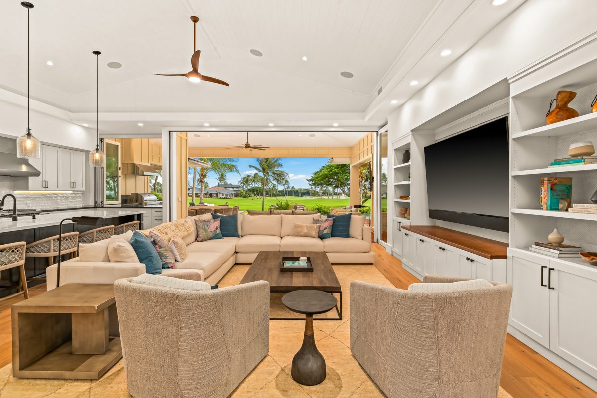 A living room with couches and chairs in it