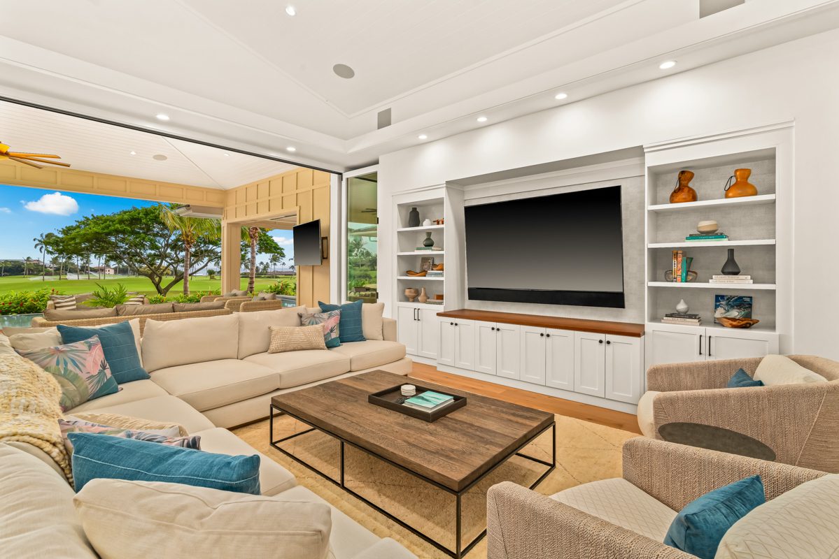 A living room with couches and a television.