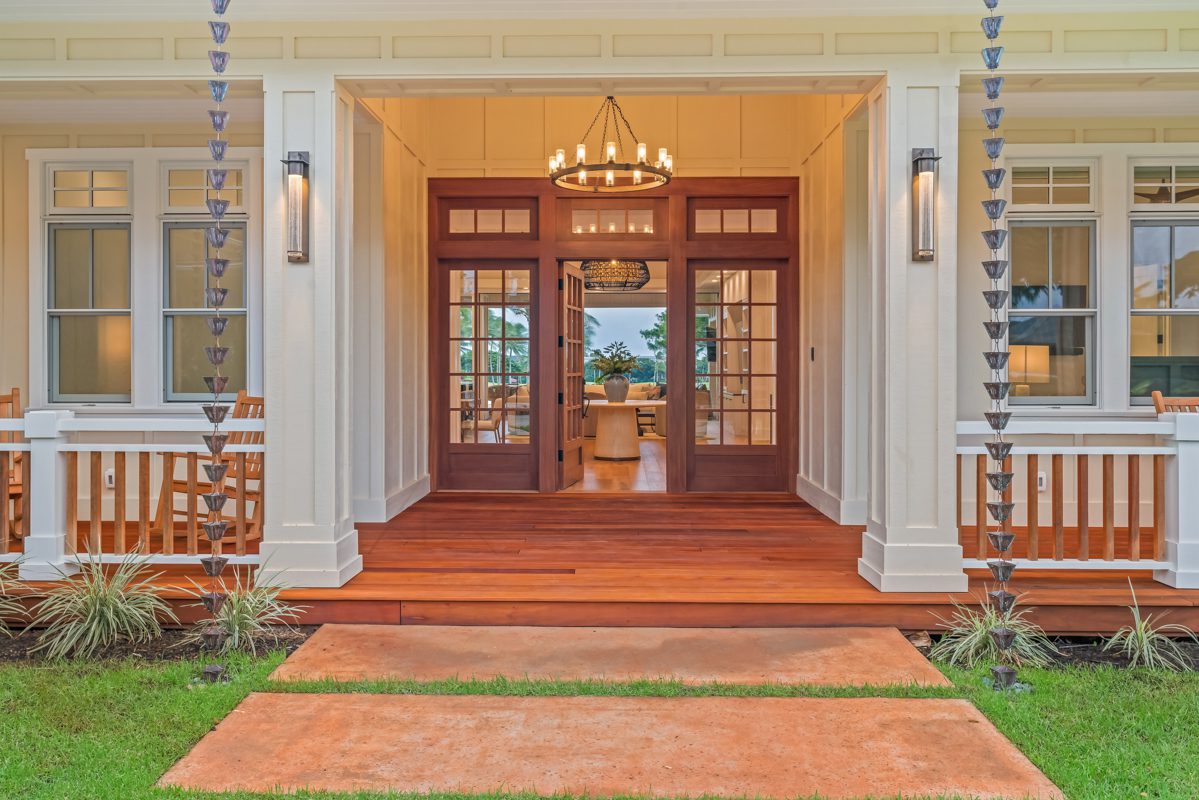 A front door with two sets of glass doors.