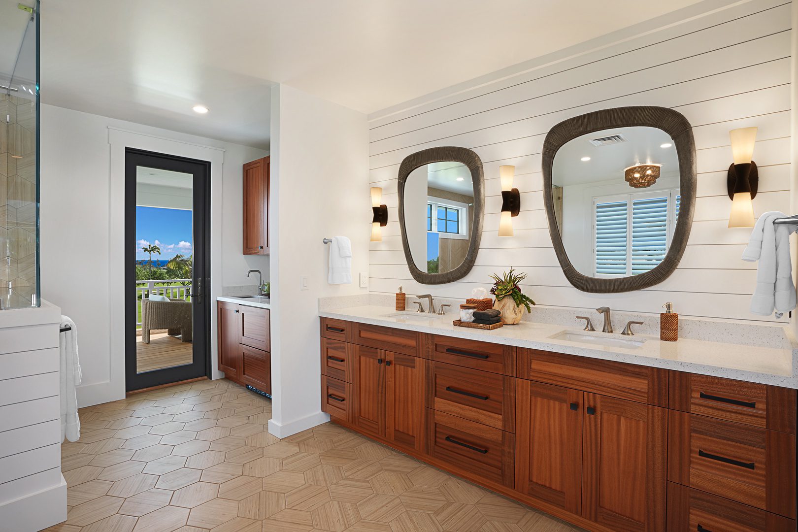 A bathroom with two sinks and mirrors in it