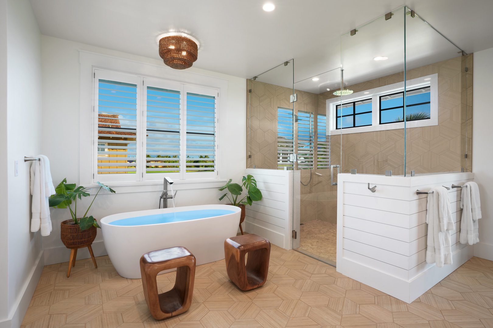 A bathroom with a tub, shower and sink.
