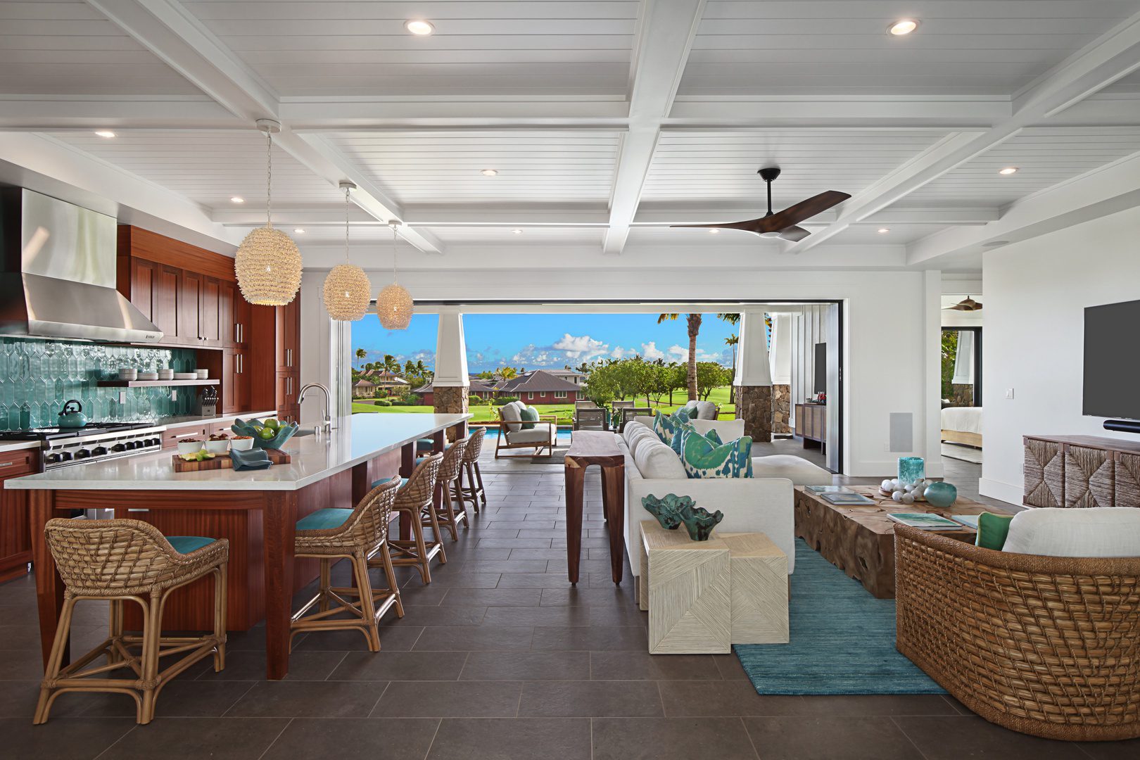 A living room filled with furniture and a sliding glass door.