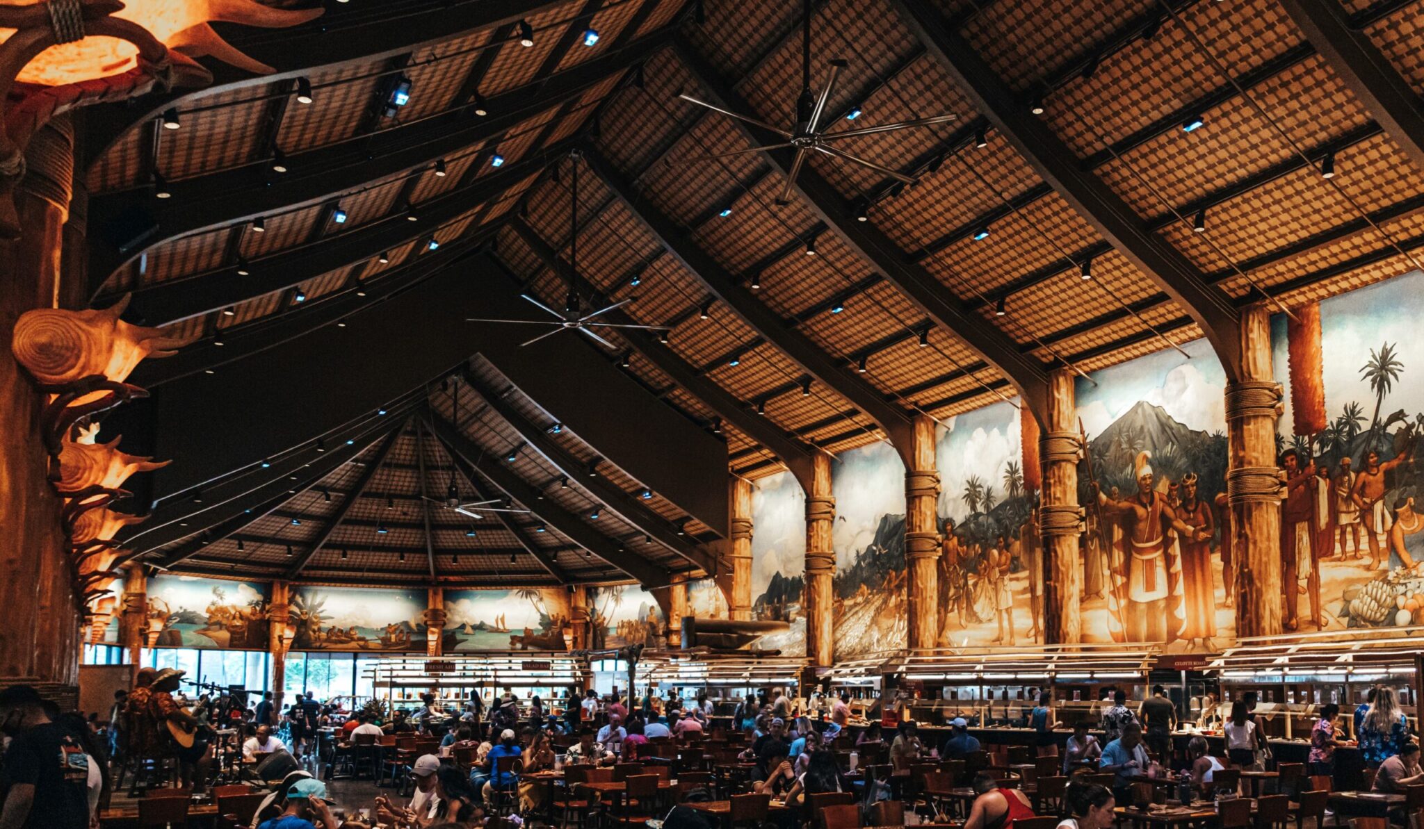 A large crowd of people in an indoor arena.